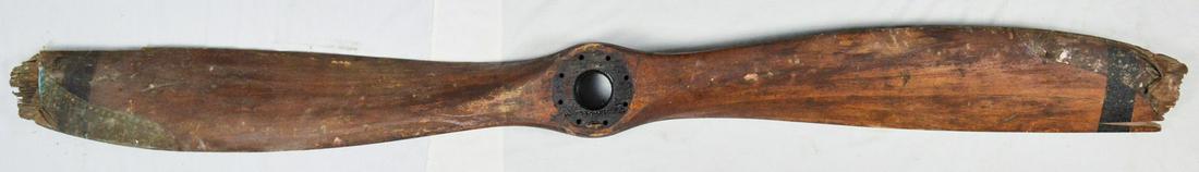Vintage Early Wooden Propeller: Vintage early wooden propeller that was used on an airplane. One side of the propeller has oil from the engine and the other side is relatively clean. Maker is unknown but the marks are “1575” on
