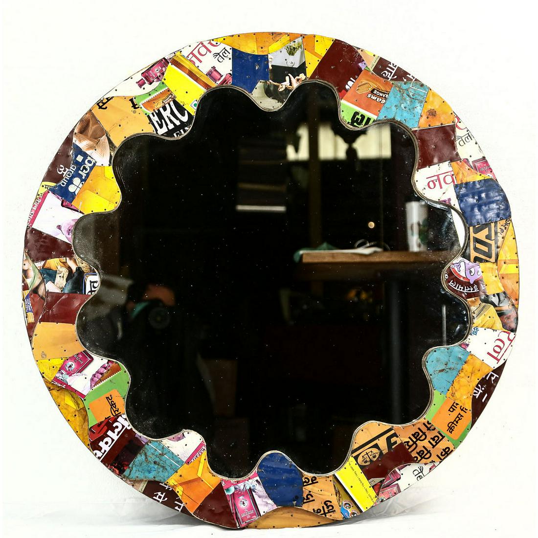 Round Mirror With Colorful Collage on Wood: Round Mirror With Colorful Collage on Wood. 2 layers of wood, top has brightly colored Indian advertisements and pictures attached. Mirror is in great shape. Wood is worn and somewhat dirty. See photo