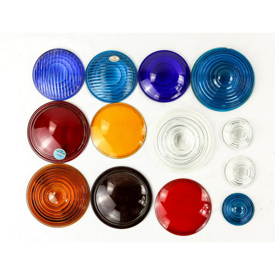 Lot of 17 Original Railroad Signal/Lamp Lenses: Lot of 17 glass Fresnel lenses. 2 - 2.75" clear Fresnel, 1 - 2.75" Fresnel blue, 3 - 4.5" Fresnel blue, 1 - 5.5" Fresnel clear, 1 - 4.75" amber, 1 - 4.75" red, 2 - 5.25" red, 1 - 5.5" Fresnel blue, 1