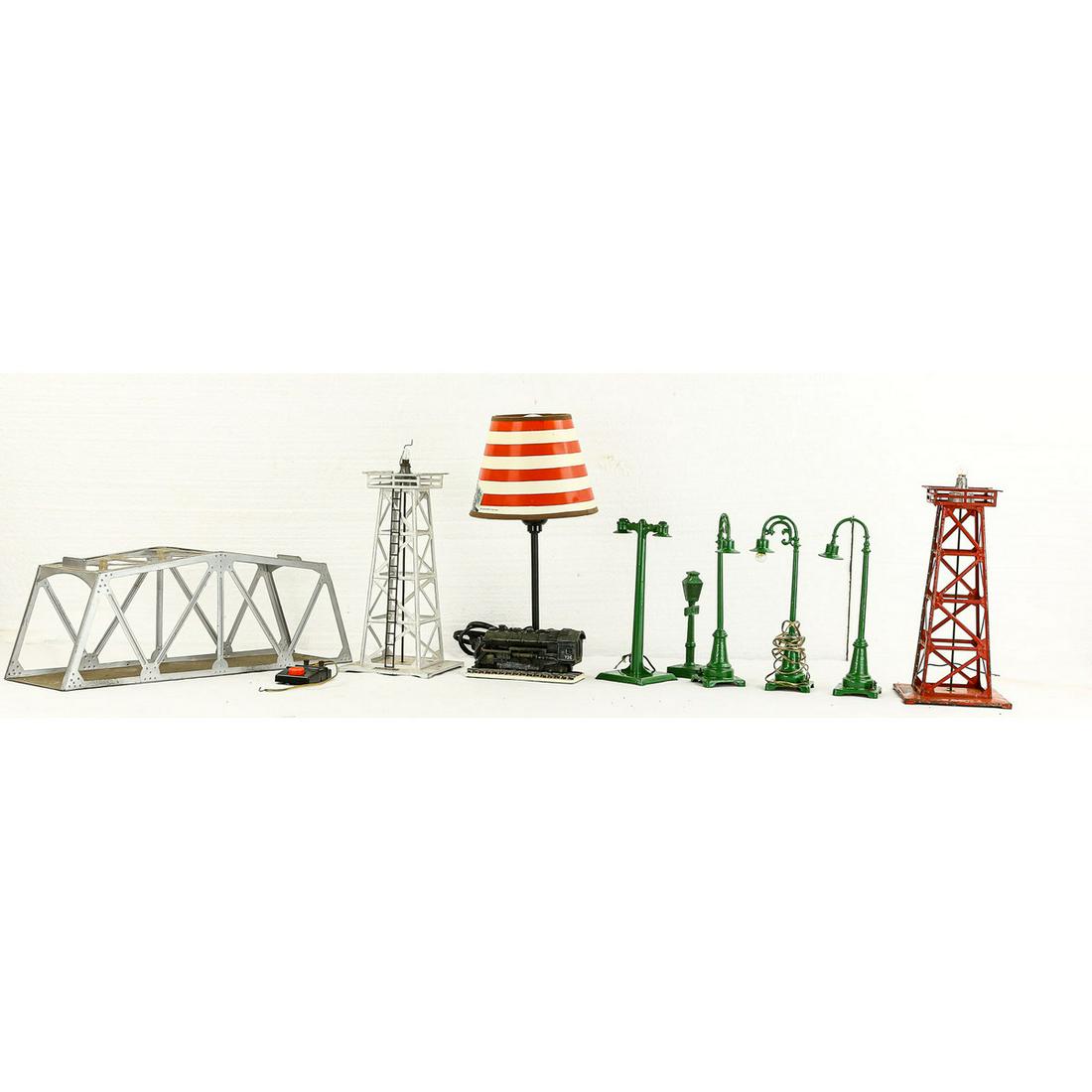 Lionel Train Accessories Lot: Description: Lot contains 3 No. 68 Lionel street poles, a Warner Bros Screen Classic street light, a Flyer street light, a Lionel 394 beacon in silver, a Lionel 394 beacon in red, a Lionel lamp made i