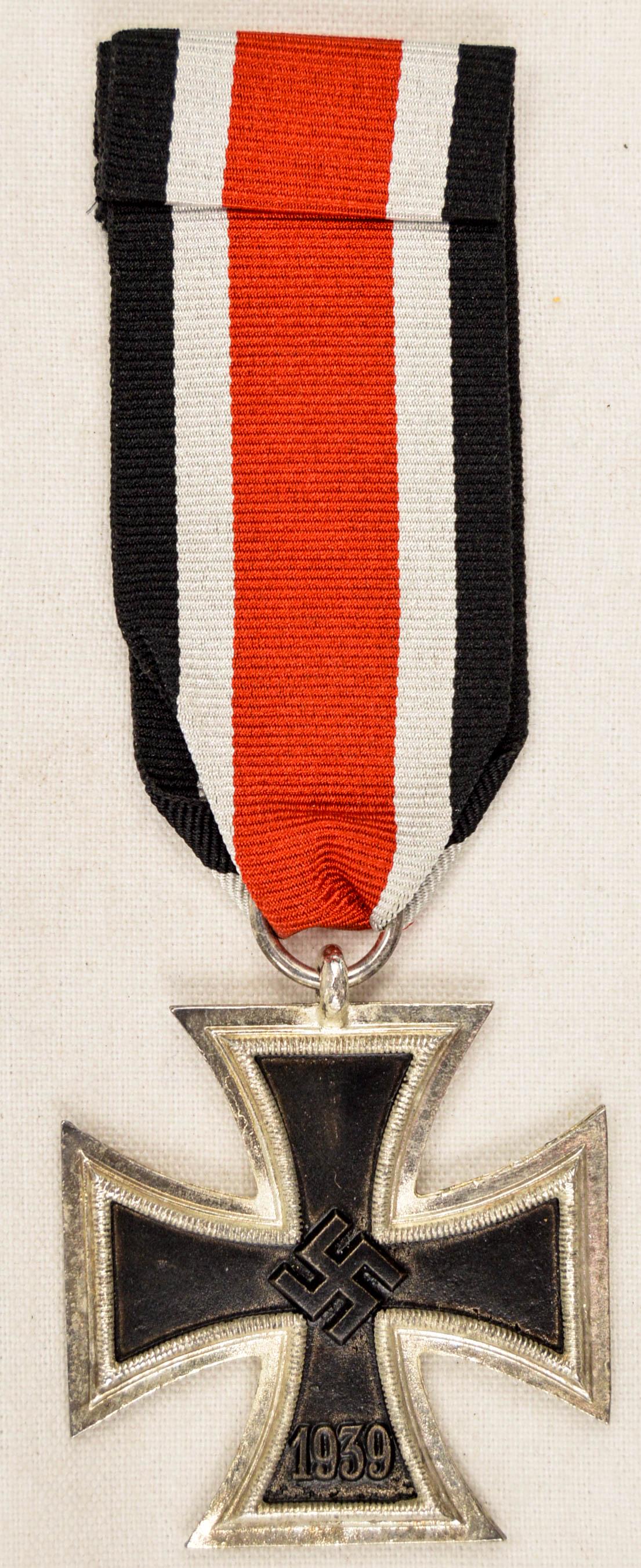 German WWII 2nd Class Iron Cross Decoration: German World War II 2nd Class Iron Cross Decoration. Measures 1 11/16” wide by 1 11/16” tall. The front shows a swastika in the center of the four armed maltese cross. The lower arm is dated ‘19