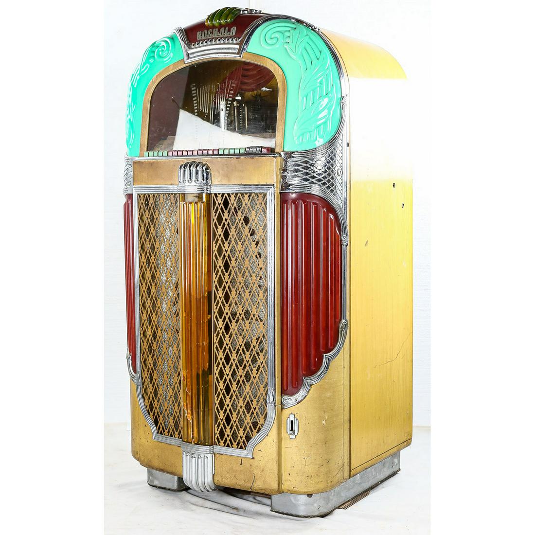 Rockola Jukebox Model 1428: Rockola Jukebox Model 1428, Beautiful working jukebox, has a crack in middle glass at bottom, otherwise outer plastic is all good, original finish blonde case, original back door, no key, has coin gea