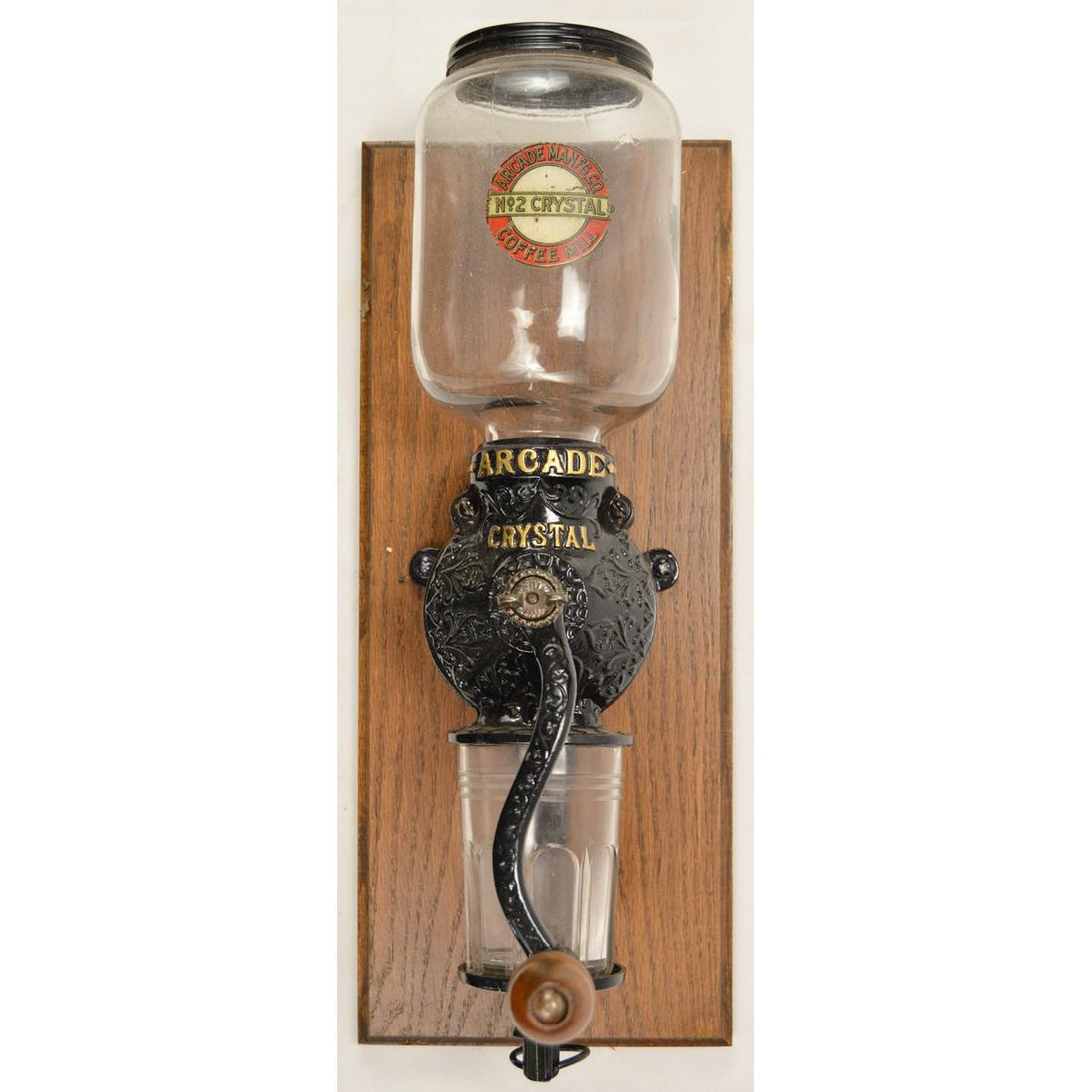 Arcade Crystal No. 2 Wall Coffee Grinder: A wall mounted coffee grinder made by Arcade in the late 1800â€™s. Grinder comes with the original hopper and catch. Neither catch nor hopper have any cracks or chips. Hopper reads â€œCrystal