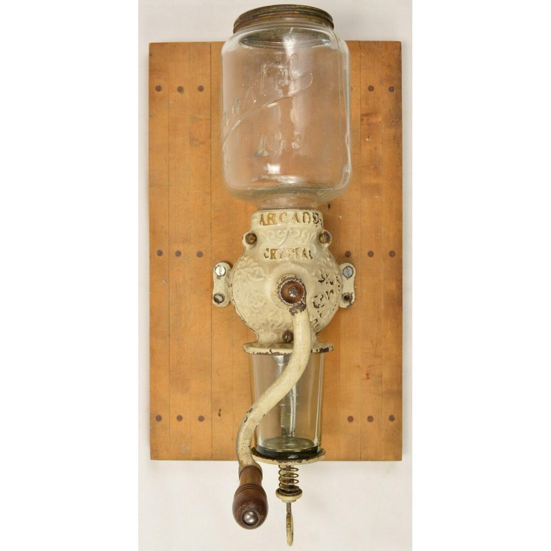 Arcade Crystal No. 3 Wall Coffee Grinder: A wall mounted coffee grinder made by Arcade in the late 1800â€™s. Grinder comes with the original hopper and catch. Neither catch nor hopper have any cracks or chips. Hopper reads â€œCrystal