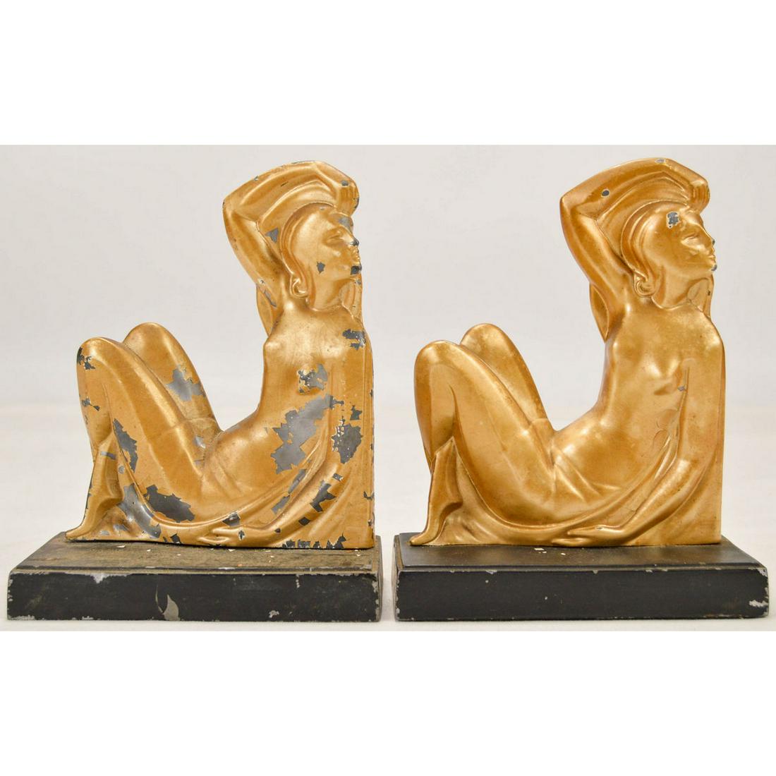 Pair Of Art Deco Bookends: Pair Of Art Deco Bookends, Made of spelter, gold and black, original paint, with some loss to paint, depicts nude woman reclining with arm above head, attributed to Frank art.