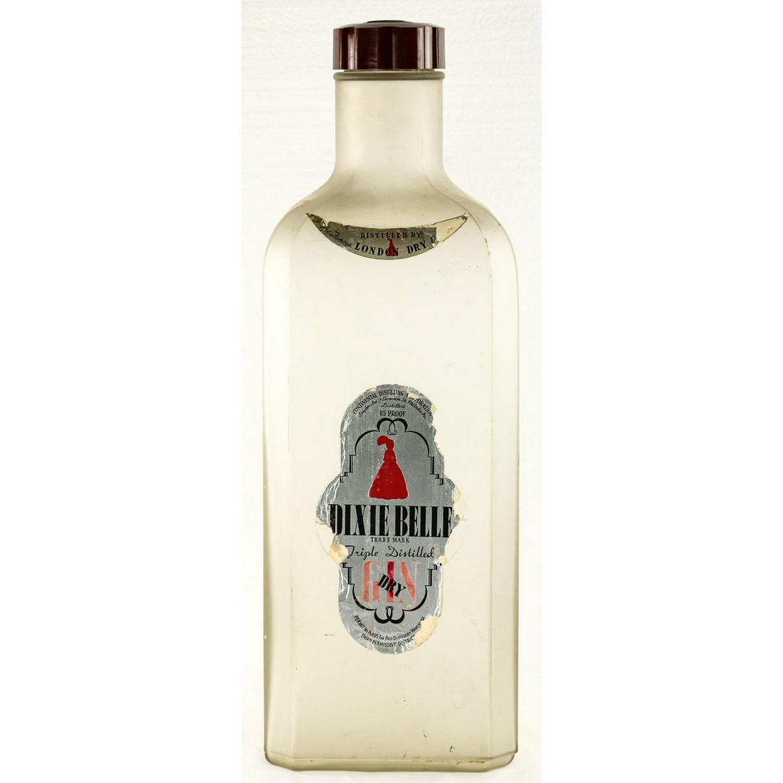 Large Vintage "Dixie Bell" Gin Display Bottle: Large vintage glass display bottle with cap advertising "Dixie Bell" Dry Gin. Paper label has some light tearing and pieces missing but is still legible. No cracks in glass. Overall fair to good condi