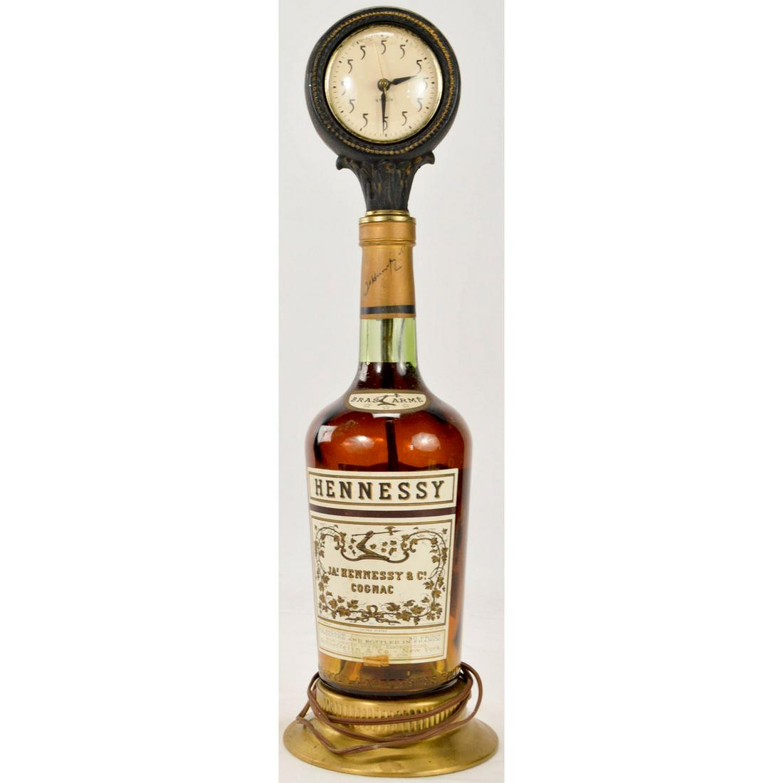 Hennessey Advertising Bar Display Clock: Vintage Advertising Hennessey Bar Display Clock, Vintage, working, bar display clock depicting a bottle with an elaborate stopper advertising Hennessey's congnac, overall good condition. 21.5" x 6"