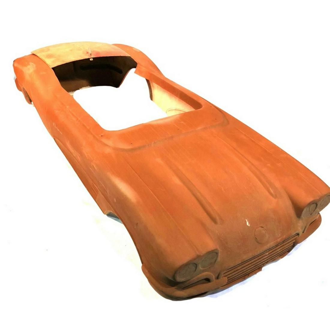 1960-61 Small Corvette Fiberglass Go-Kart Body: Small fiberglass Corvette body, used on either electric or gas power go-kart. Body has some repairs and slight damage. Also has trunk lid. Fair good condition. 75" long x 28" wide 15" high.