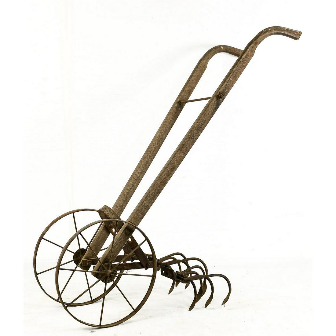Antique Primitive Farm Seeder/Tiller: Antique Primitive Farm Seeder/Tiller, A primitive farm seeder/tiller manually driven, cast iron wheels and mechanism frame with two wood handles, overall in very good condition for age, great for the 