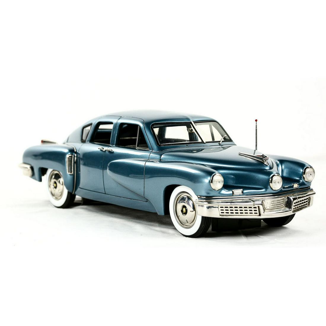 1948 Waltz Blue Tucker Model Car: Limited Edition 1948 Tucker model car in waltz blue. Missing passenger side windshield wiper. Serial #19. In 2006, Retro 1-2-3 created the Tucker Series. Never done before, Retro 1-2-3 recreated a 1:9