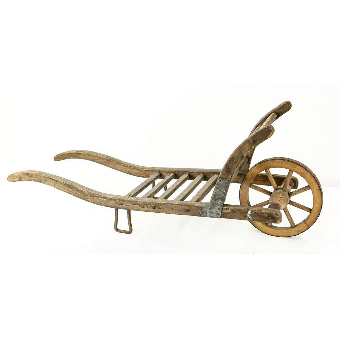 Child's Wheelbarrow Dolly: Child's Wheelbarrow Dolly. Made of wood. Overall very good condition. Measures 29" long, 10.5" wide, 12" deep.