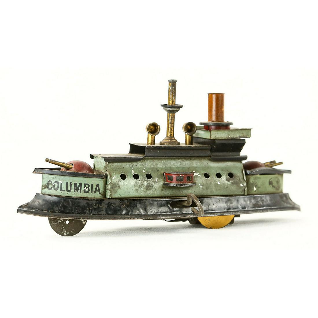 Columbia Gun Ship Wind Up Toy: Mechanism does work. Columbia Battleship. Good condition. Measures 8" x 4" x 2".