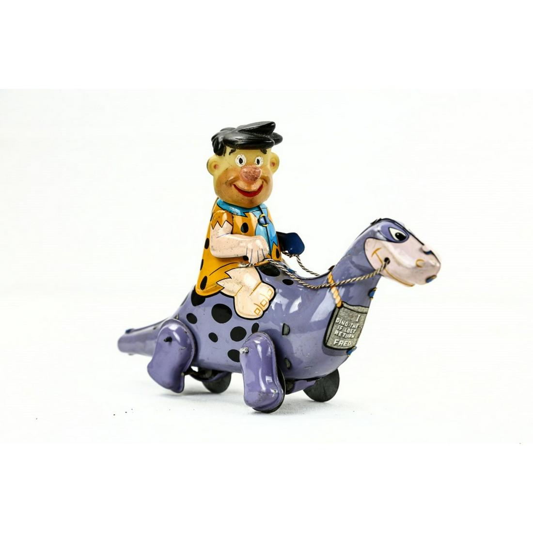 Marx Fred Flintstone on Dino Wind Up Toy: Mechanism works. Very good condition. Measures 8" x 5.5".