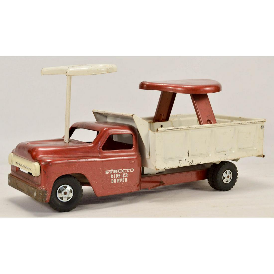 Vintage Structo Rider Dump Truck: Vintage Structo Rider Dump Truck, A vintage toy dump truck made by The Structo Toy Co, this toy truck can be ridden by a small child and has a steering wheel, the truck is in good condition with just