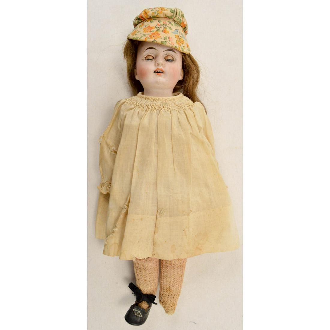 Armand Marseille Bisque Shoulder Head Vintage Doll: Bisque shoulder head on leather body, bisque lower arms. 11" tall. Maker presumed Armand Marseille. Glass sleep eyes. Open mouth with teeth. Original sparse mohair wig. Antique clothing, missing shoe.