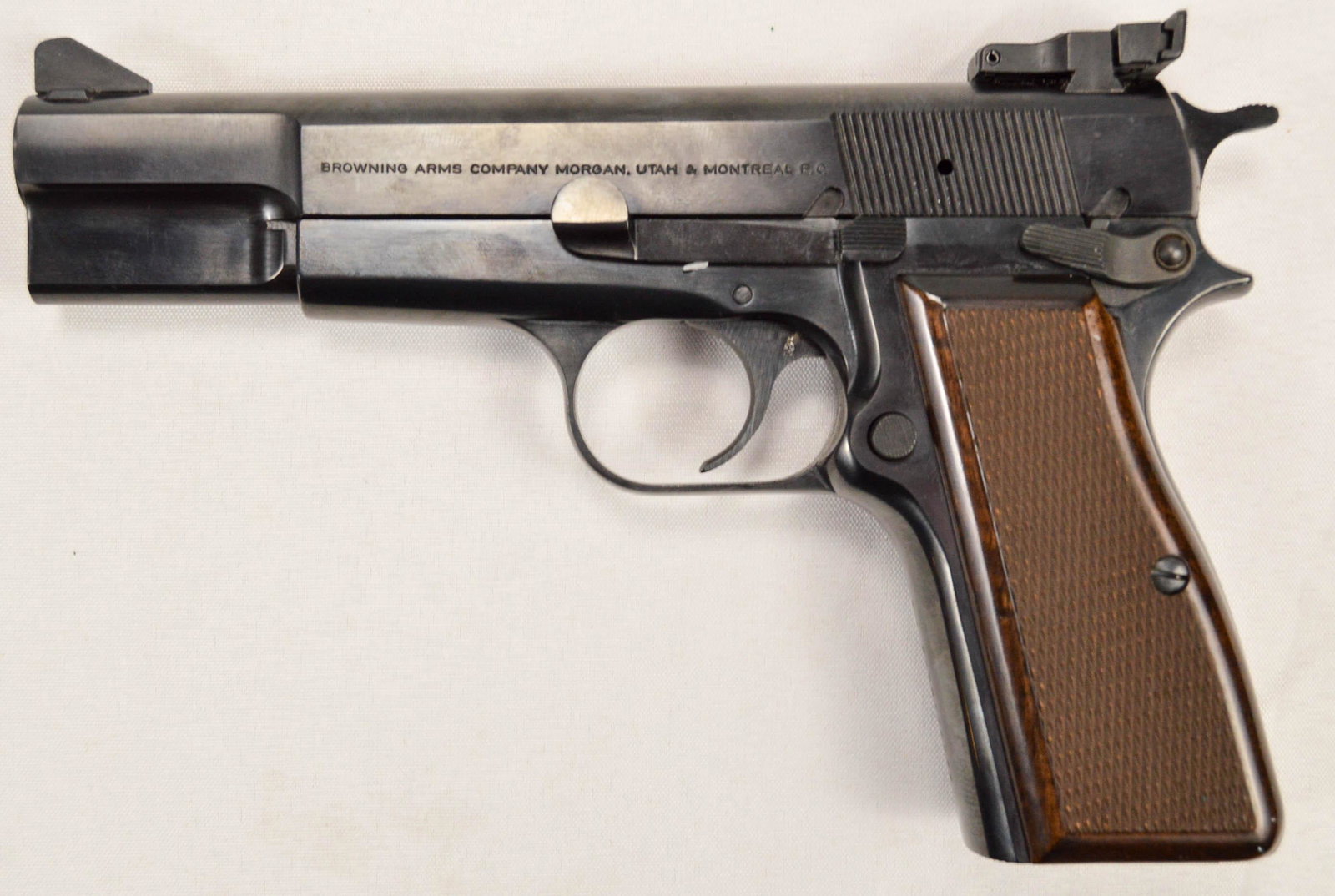 Browning Hi-Power 9mm Pistol: Belgian made, assembled in Portugal. Newer production in plastic hard case. Factory adjustable target sights. Ambidextrous safety. Excellent condition. Appears to be very lightly used. Good target pis