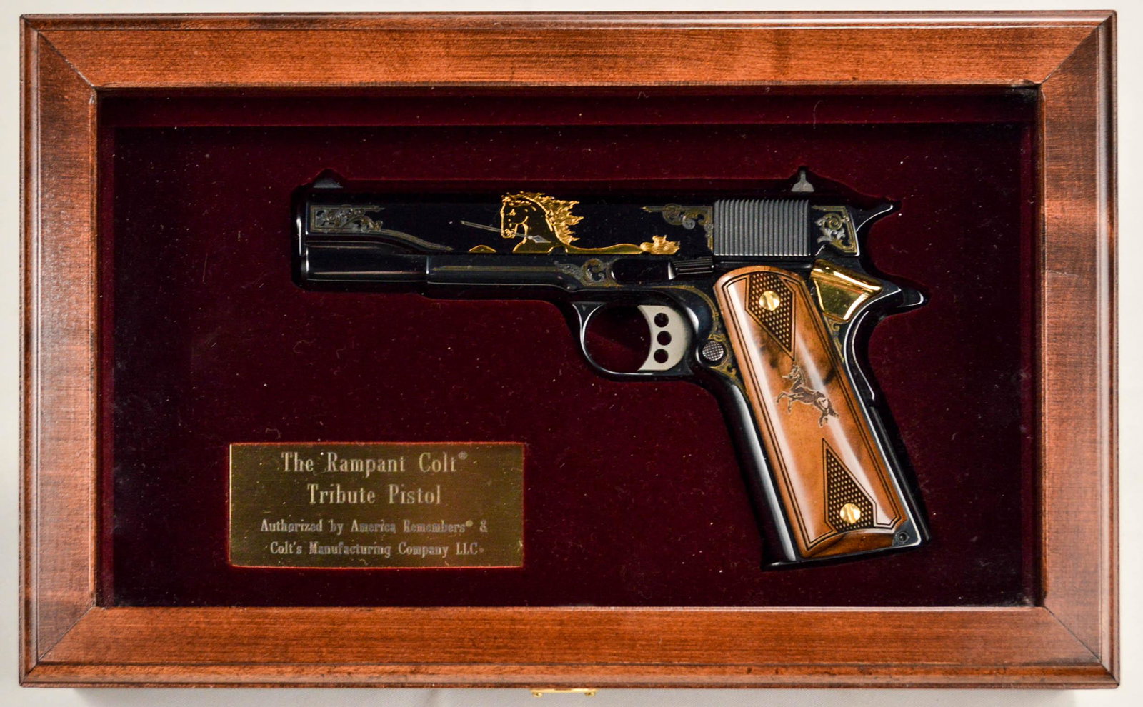 Colt 1911 America Remembers Tribute Pistol: Colt 1911 America Remembers, the "Rampant Colt" Tribute Pistol, excellent condition, appears unfired, very minor handling marks includes factory plastic case as well as wooden display case and all pap
