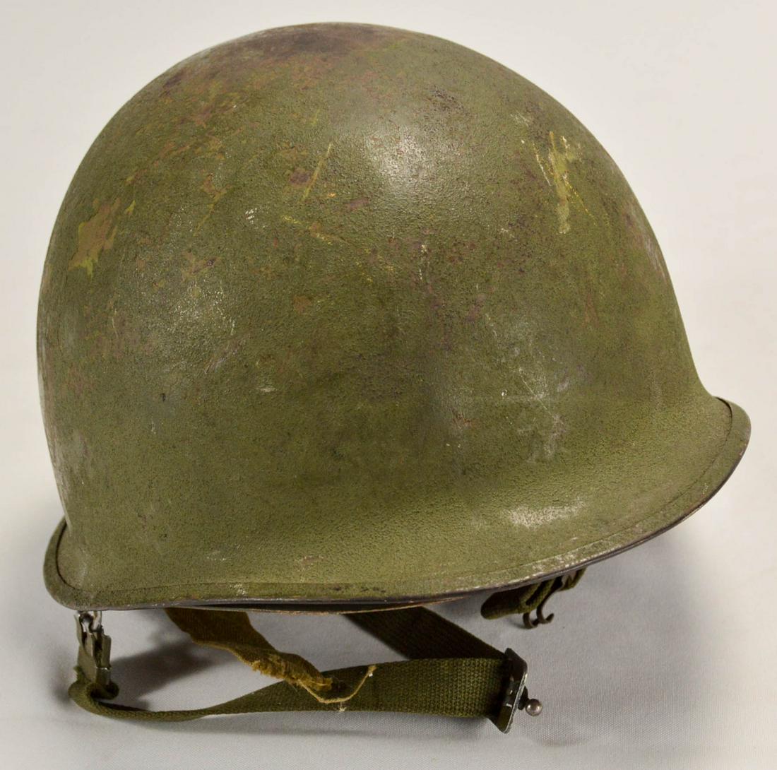 US M1 Military Helmet and Liner: US M1 Military Helmet and Liner, rear seam, swivel bale with Firestone liner, well used with minor dent and paint scuffs, has chin strap.
