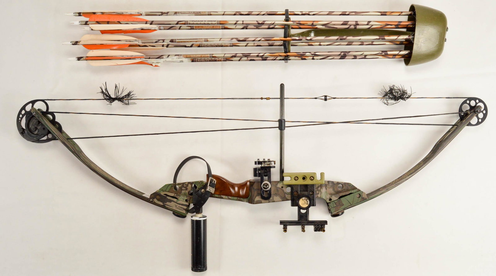 Matthews Solocam Compound Bow in Case With Extras: Matthews Solocam Compound Bow in Case With Extras. Camoflauged compound bow with 12 arrow shafts and various tips. Lot includes forearm guard, arrow carrier, and case. See photos. Approximately 42" lo