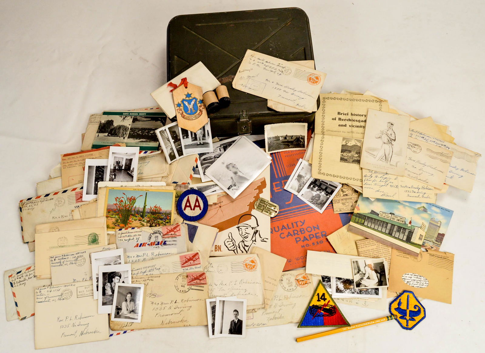 US WWII Bring Back Box: US WWII Bring Back Box. Includes a mix of postcards, letters, patches, photos, and memorabilia. Includes a dog tag for a "James P Robinson" out of Nebraska. Letters included also from a "Paul Robinson