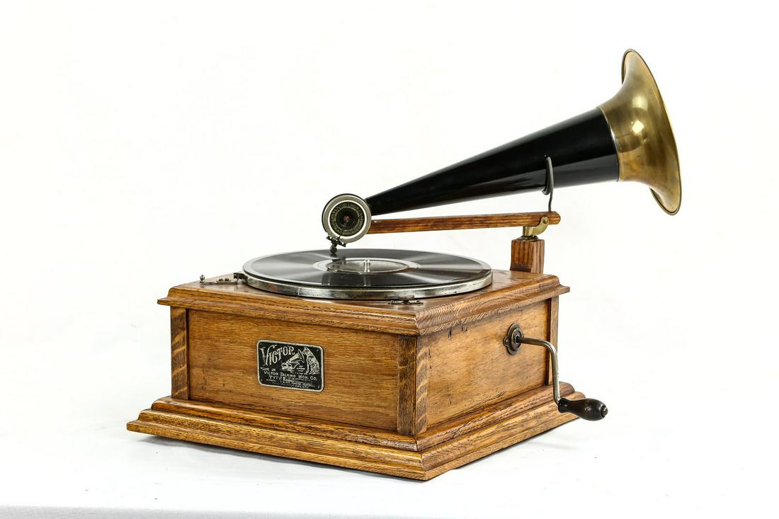 Fantasy 78rpm Disc Phonograph With Horn: Someone put a lot of work into this machine to make it look like an old phonograph. It was built from parts of original machines. It winds up and plays well and looks pretty but has no collector value