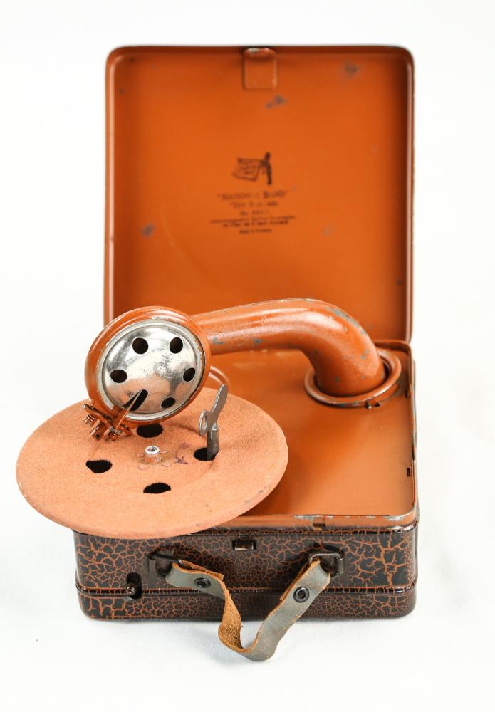 National Band Toy Phonograph: National Band Toy Phonograph, No.5009, this unique and upscale phonograph has no horn; the sound travels from the reproducer down and out of the opening in the side of the machine. It has a beautiful