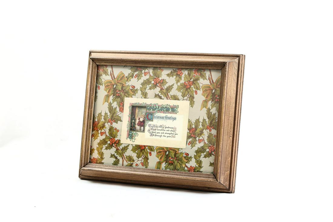 Musical Christmas Picture Frame: An 11" X 14" picture frame holds a postcard size Christmas Greeting with winter scenes revolving in a window in the greeting card. A music box is internally mounted in the frame and winds from the bac
