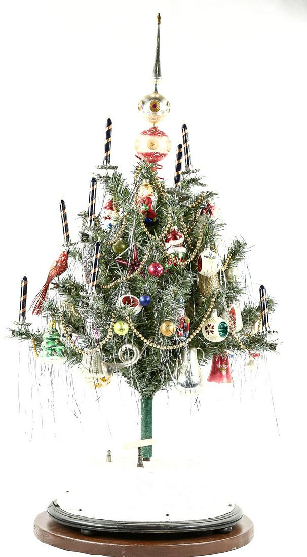 Musical Christmas Tree J.C. Eckardt Germany: Musical rotating 14" diameter stand made by J.C. Eckardt of Stuttgart Germany. Plays 2 tunes, O Come Little Children and Thou Hidden source of Calm Repose. Winds and plays well with separate music shu