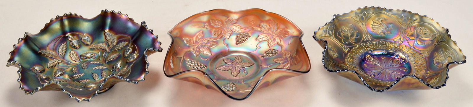Lot of 3 Vintage Glass Bowls Fenton and Northwood: Lot of 3 Vintage Glass Bowls Fenton and Northwood. Includes 9" Dragon and Lotus Carnival Glass Bowl, 9" Leaf Carnival Bowl, 8.5" Northwood Strawberry Carnival Glass Bowl. In overall good condition wit