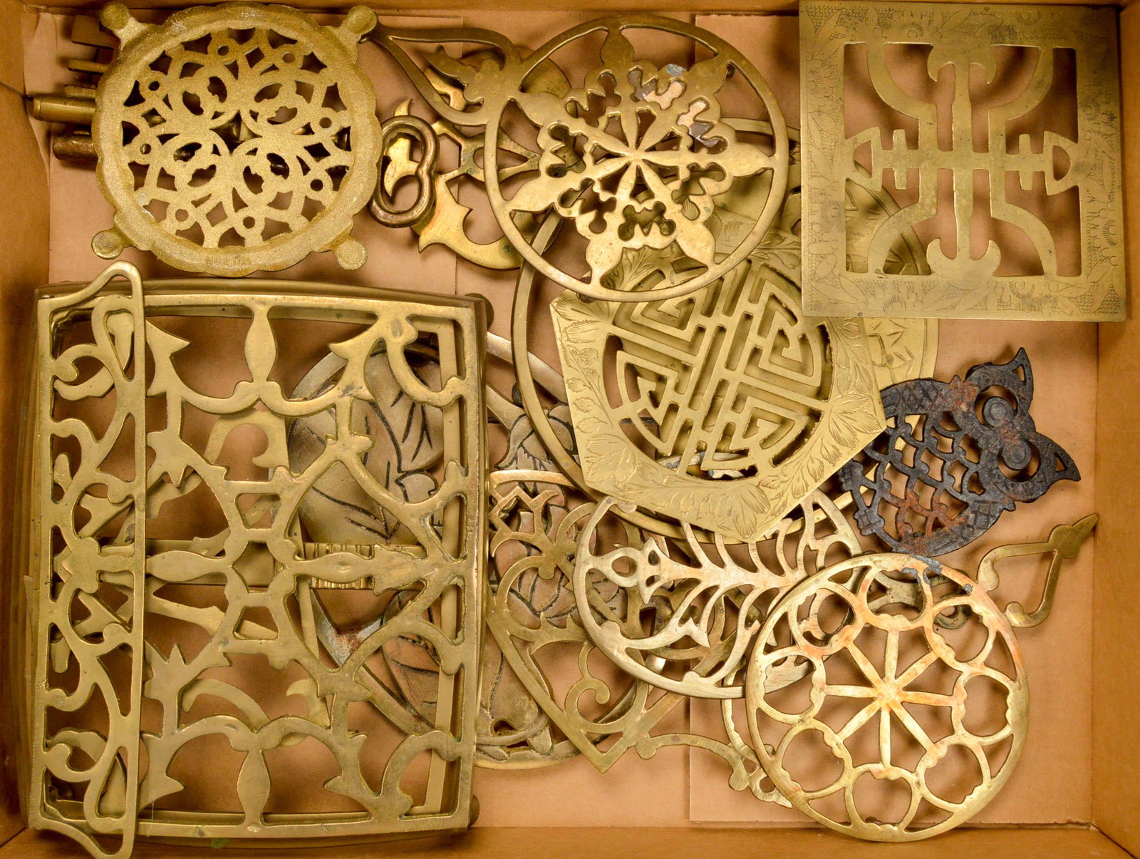 Box Lot Brass Trivets: Box of misc. brass trivets. See photos.