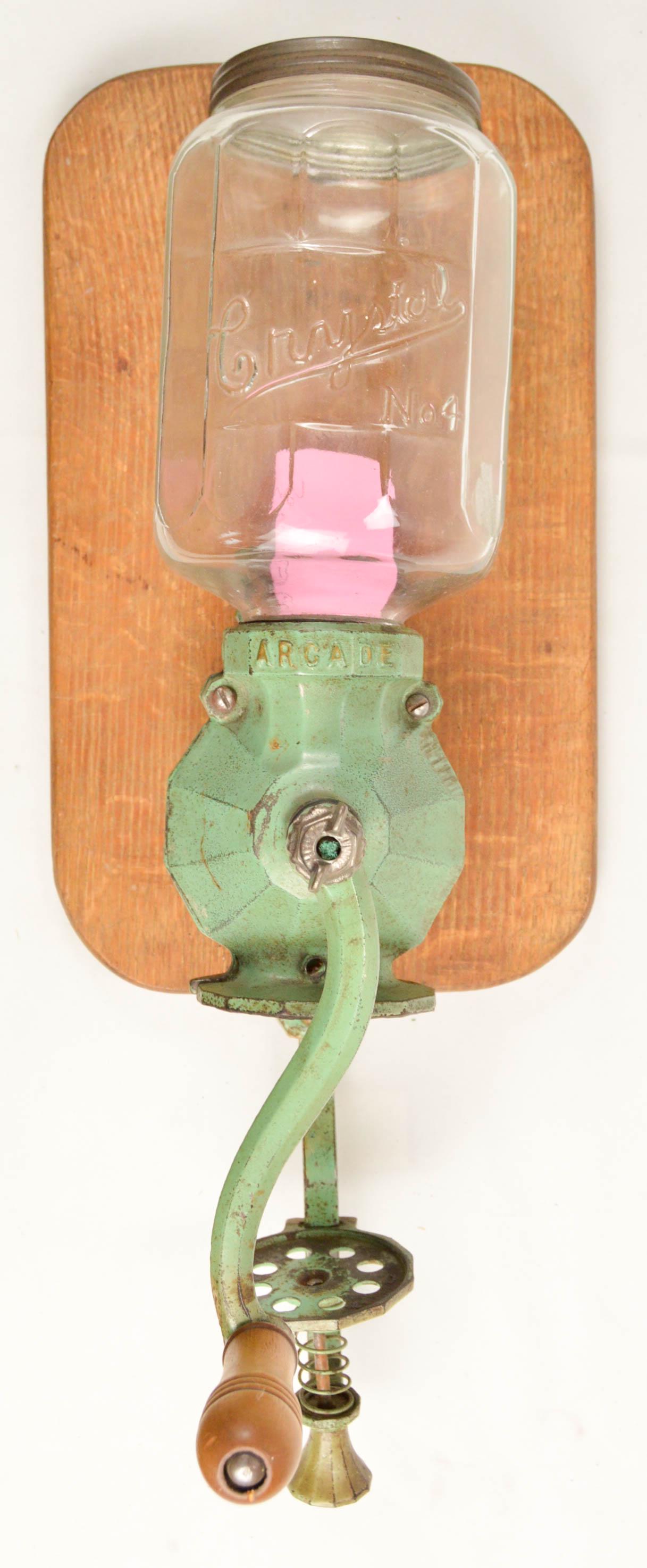 Arcade No. 4 Art Deco Wall Coffee Grinder: Wall mount hand crank coffee grinder made by the Arcade Mfg. Co. of Freeport Illinois. This is an Arcade Crystal No. 4 Art Deco style grinder with embossed Deco style hopper glass and embossed hopper 