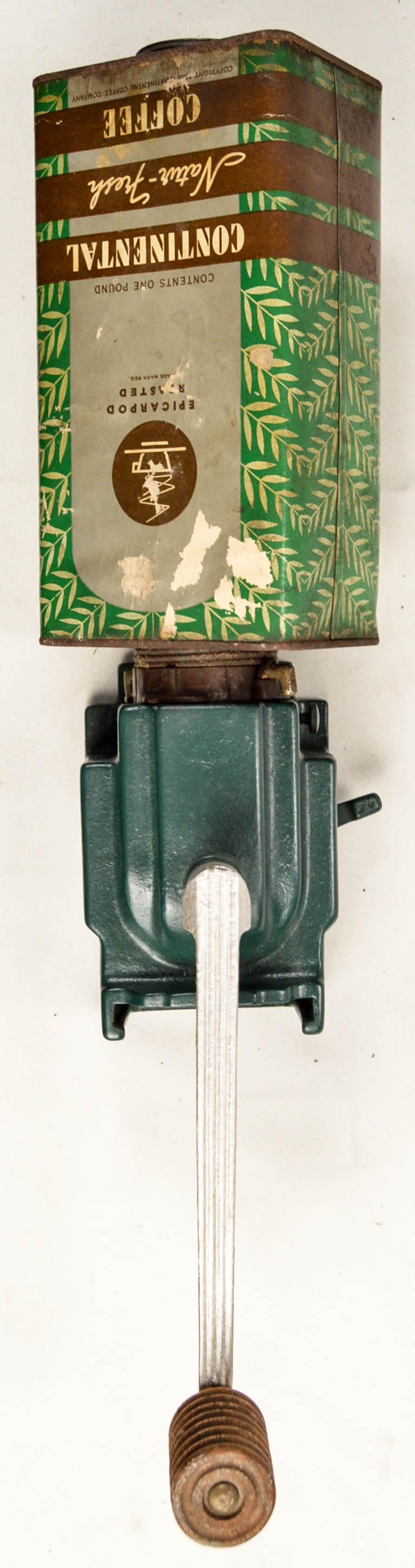 Continental Coffee Wall Grinder: Pre war wall coffee grinder to use with Continental Coffee products. Late Deco early Moderne style grinder uses a cardboard container of Continental beans for the hopper. The container screws onto the
