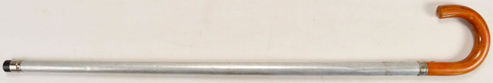 Vintage "Flask" Walking Cane: Vintage aluminum body, wood handle walking cane that will hold liquid in a separate container inside Complete in good condition with a few small dings throughout. 34-3/4" long.