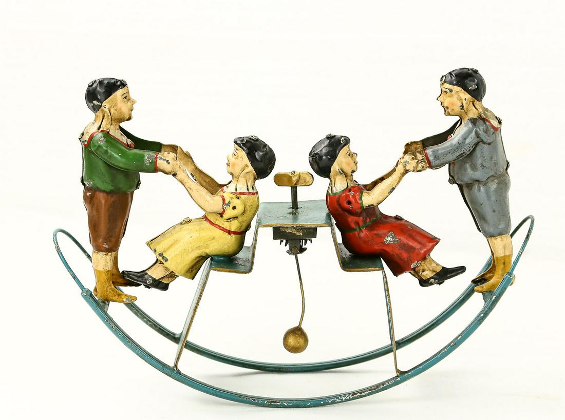Early German Teeter Totter Toy: Wind up mechanism does work. Excellent condition. Measures 10" x 7".