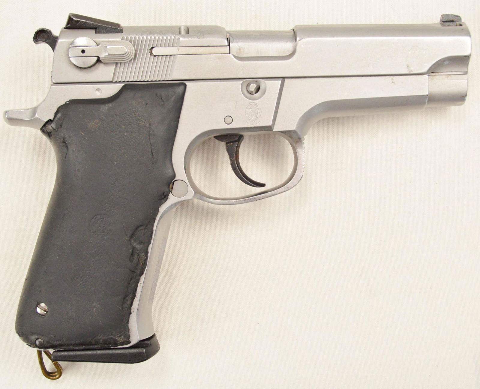 Smith & Wesson 5906 9mm Pistol: Police trade. Fair used condition. Lots of dents and dings. Well worn grips. Comes with 1 extra magazine. SN RJF2074