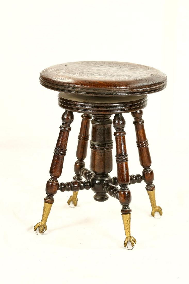 Round Wood Piano Stool w/Ball & Claw Feet: Four legged piano stool has swivel 14.5" seat, legs have sculptured design with claw feet holding glass balls, nice condition.