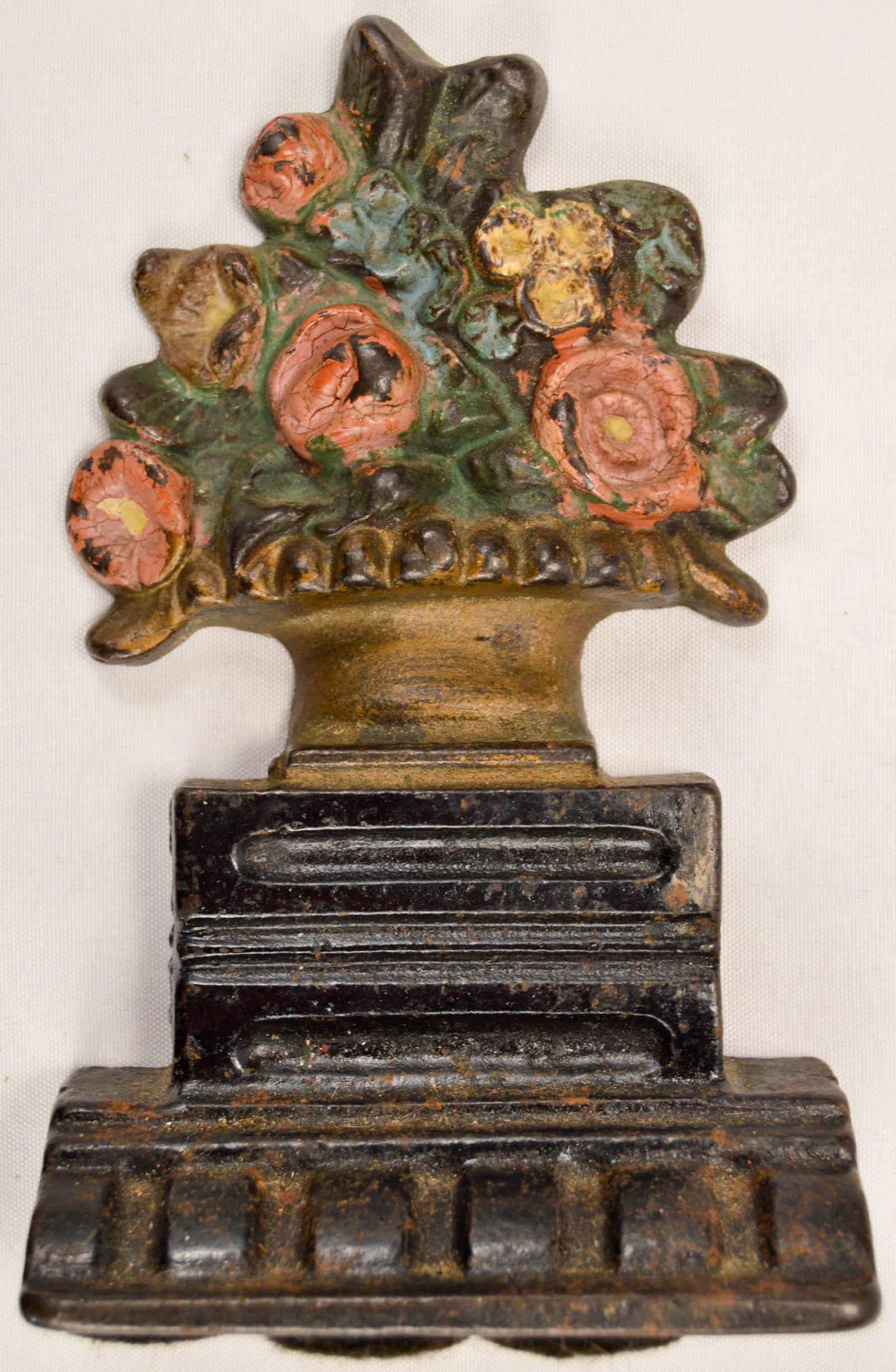 Cast Iron Flower Basket Doorstop: Named and dated on back, see photos. Measures 6.5"