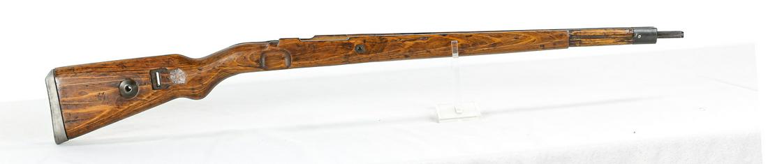 Kar98k Mauser Stock: A laminated wood Kar98k stock with cupped butt plate. Stock is without hand guard. Stock has some dents and dings from service and butt plate is slightly loose. Wood between trigger and magazine body