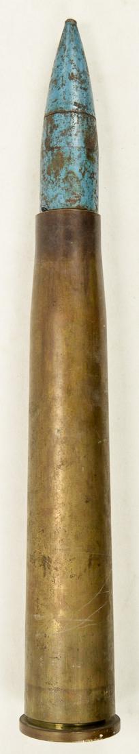 US 40mm Dummy Shell: A 40mm dummy shell with blue painted inert projectile. No headstamp on casing. Shell is in overall good condition. Measures 17.125" in length.