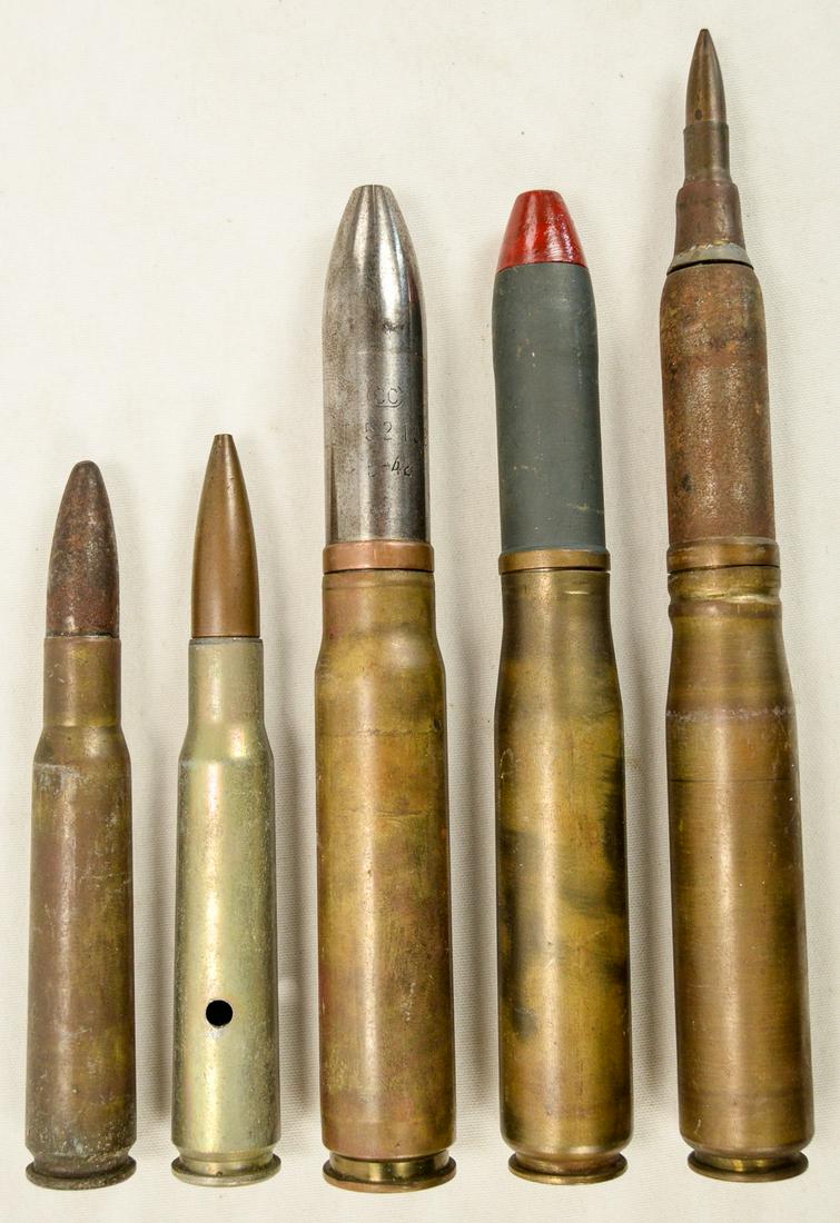 WWII 4 Large Ammo Shells & 1 Trench Art Lighter: Lot of 4 larger ammo shells including 2 .50 cals and 2 20mm shells and 1 trench art lighter (left photo), dated to WWII. All rounds have used primers or no primers at all and are for display purposes 
