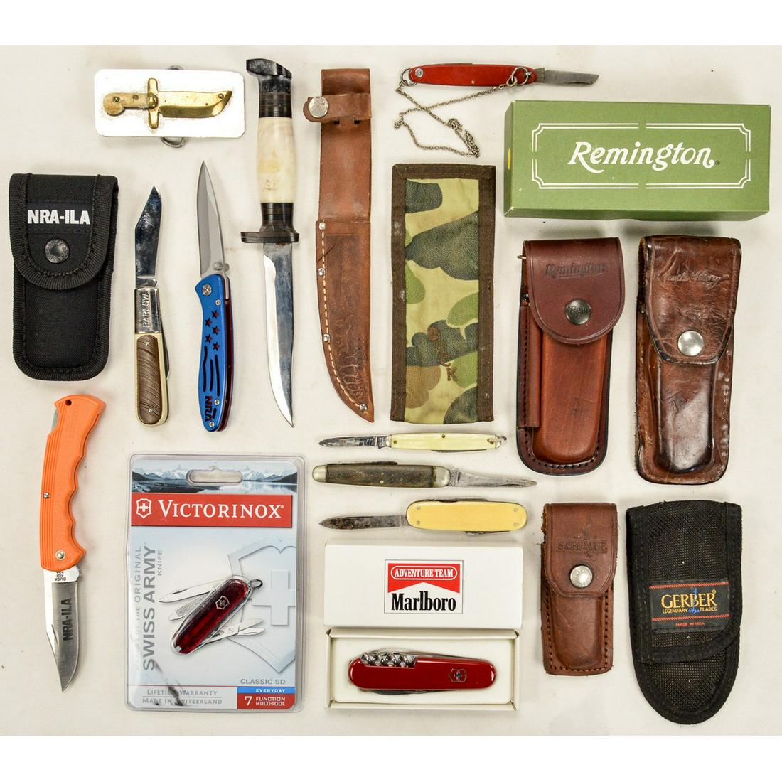 Lot of 10 Knives and Misc. Sheaths: Lot of 10 knives with 5 extra sheaths and a small plaque. Knives are made by BuckLite, NRA, Victorinox and more. Some knives are like new and others are in used condition. See photos.