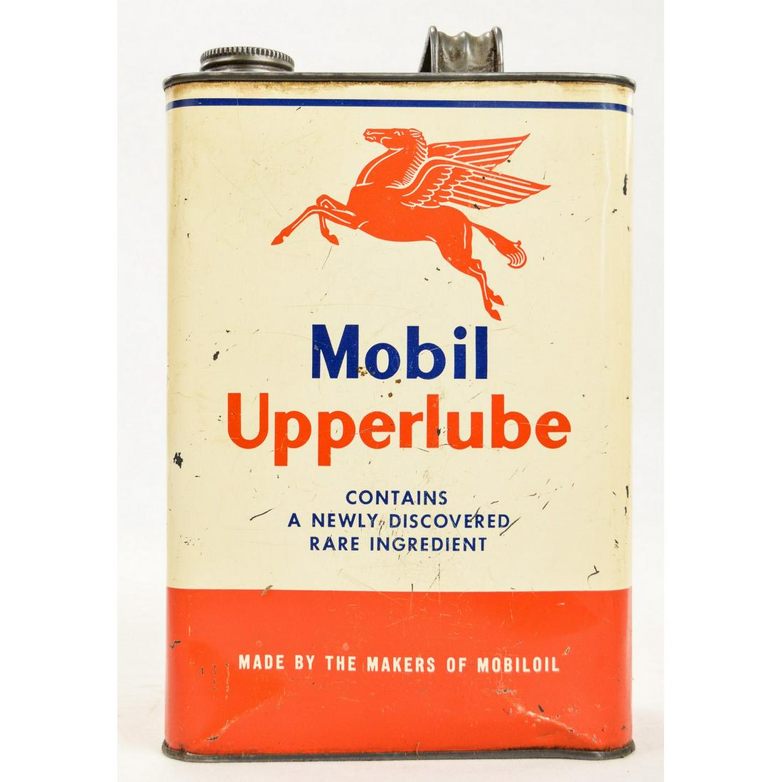 Vintage Mobil Upperlube Oil Can: An empty one gallon oil can for Mobil Upperlube. Directions and instructions on back are scratched with some words being illegible. Some wear present to can throughout. Comes with cap. Can has some de