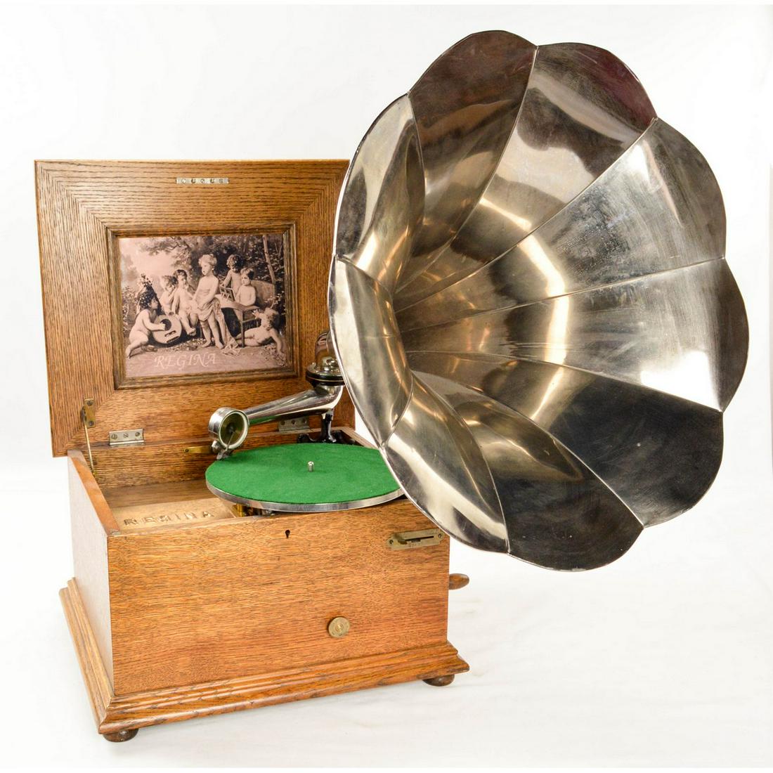 Oak Reginaphone Table Top Music Box Phonograph: This is a style 116 Reginaphone serial # 63713 shipped to Bangor Maine on Nov 28, 1905 from the Regina factory in Rahway New Jersey. Beautiful solid oak cabinet with raised lid houses a combination mu