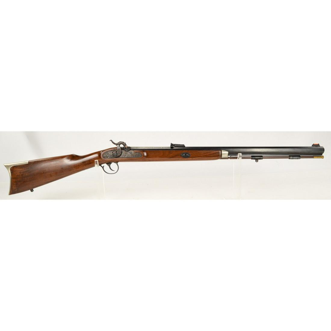 Thompson Center Renegade Rifle .54 Black Powder: A Thompson Center Renegade black powder rifle in .54 caliber. Rifle has 27" octagonal barrel with adjustable rear sight and orange front sight. Rifle finish is in overall very good condition with some