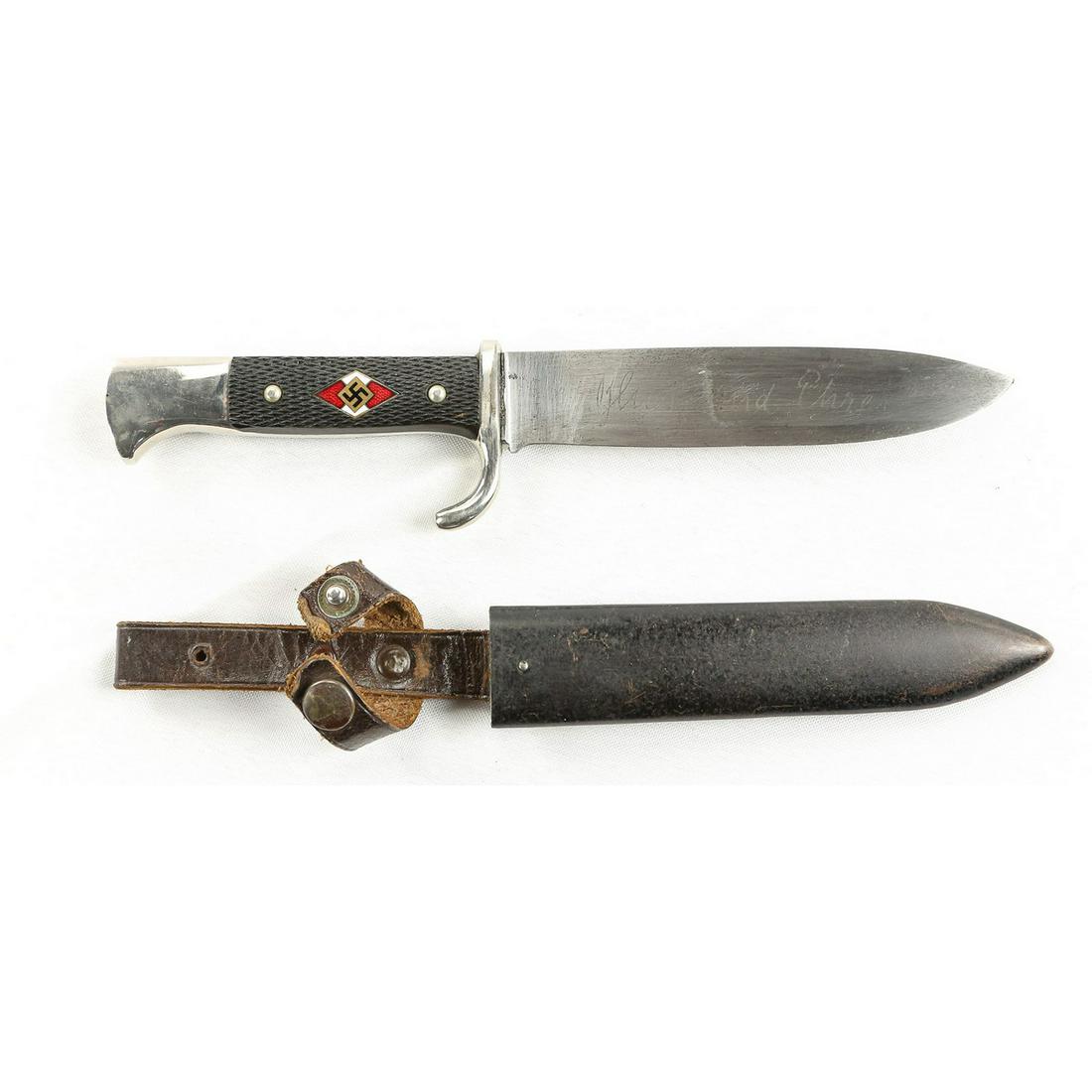 WWII German Hitler Youth Knife: E.V.S logo on blade. "Blut und Ehre" (Blood and Honor" etched on other side of blade. Missing leather washer. Everything else is excellent. Scabbard and hanger are very good. Initials "KB VC HS" scrat