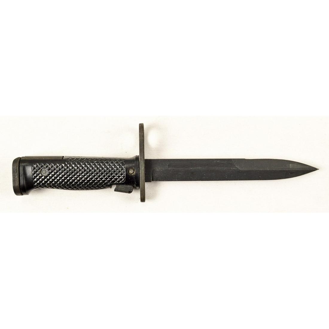 US M6 Imperial Bayonet: A US M6 bayonet made by Imperial Knife Company for the M14 rifle. Bayonet has black parkerized finish in excellent condition with minor finish wear from scabbard. Black plastic grips are in very good 