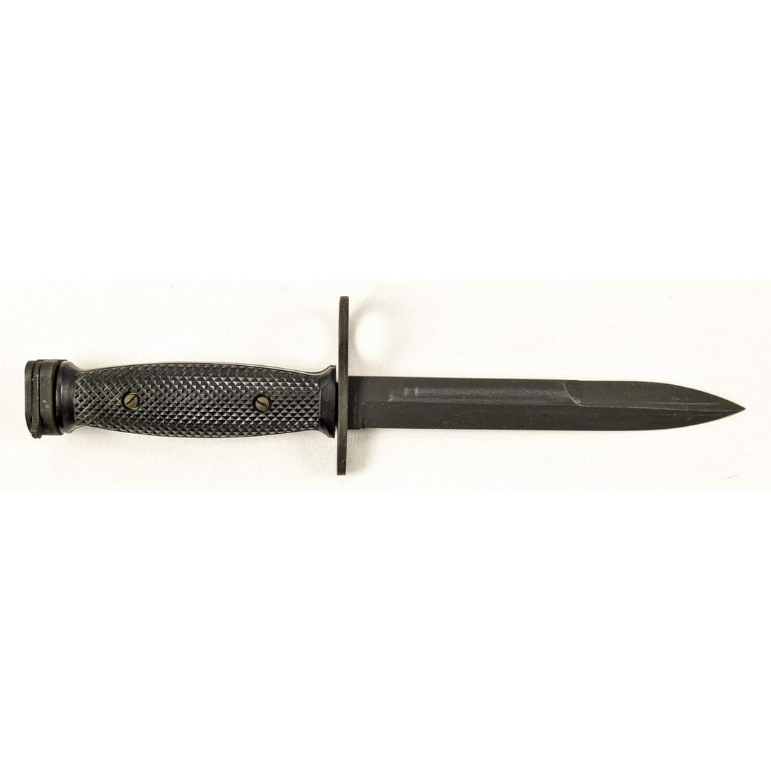 US M7 Imperial Bayonet: A US M7 bayonet made by Imperial Knife Company for the M16 rifle. Bayonet has black parkerized finish in excellent condition with finish wear from scabbard. Black plastic grips are in very good condit