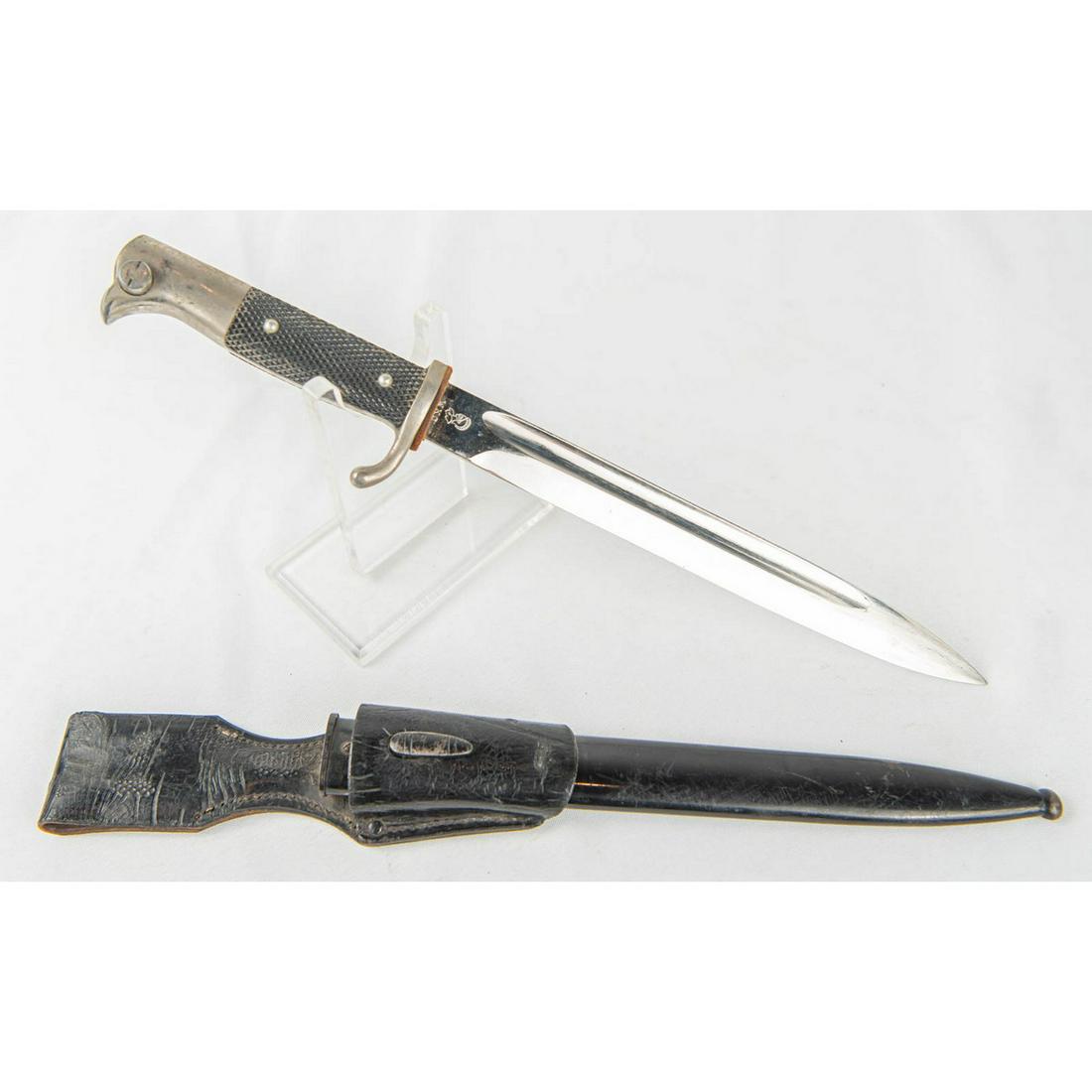 German Dress Bayonet: Stamped with WKC's knight head. Beautiful 9.75" blade with slightly loose, good washer and unmarked grips. Black painted scabbard retains most of its paint. Proper dress scabbard retains more than 50%
