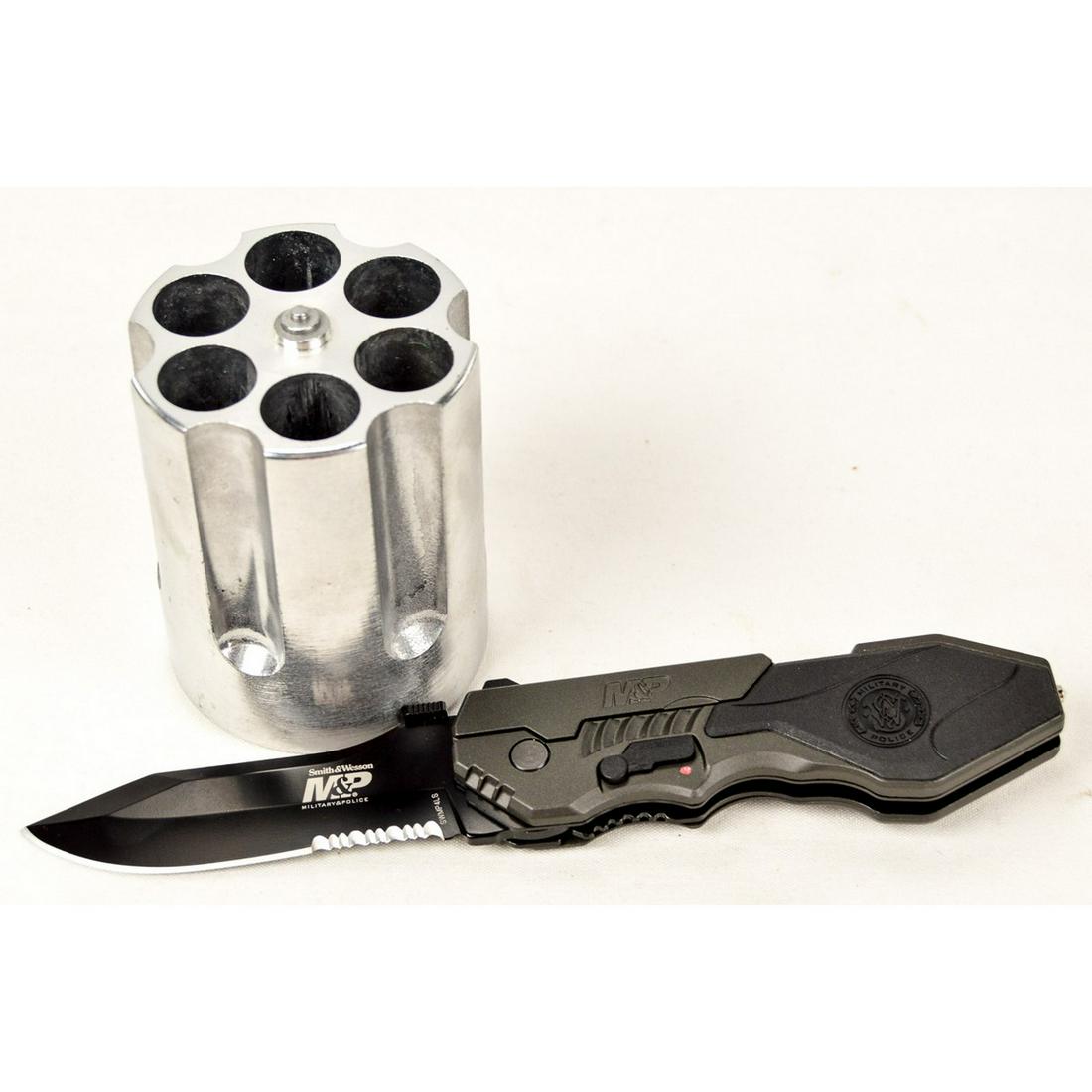 S&W MP Knife and Revolver Pen Holder: This lot contains a metal revolver cylinder pen holder. It is metal and can fit 2-3 standard pens in each of the 6 cylinders. The Smith and Wesson Military Police Knife Assisted Opening with M.A.G.I.C