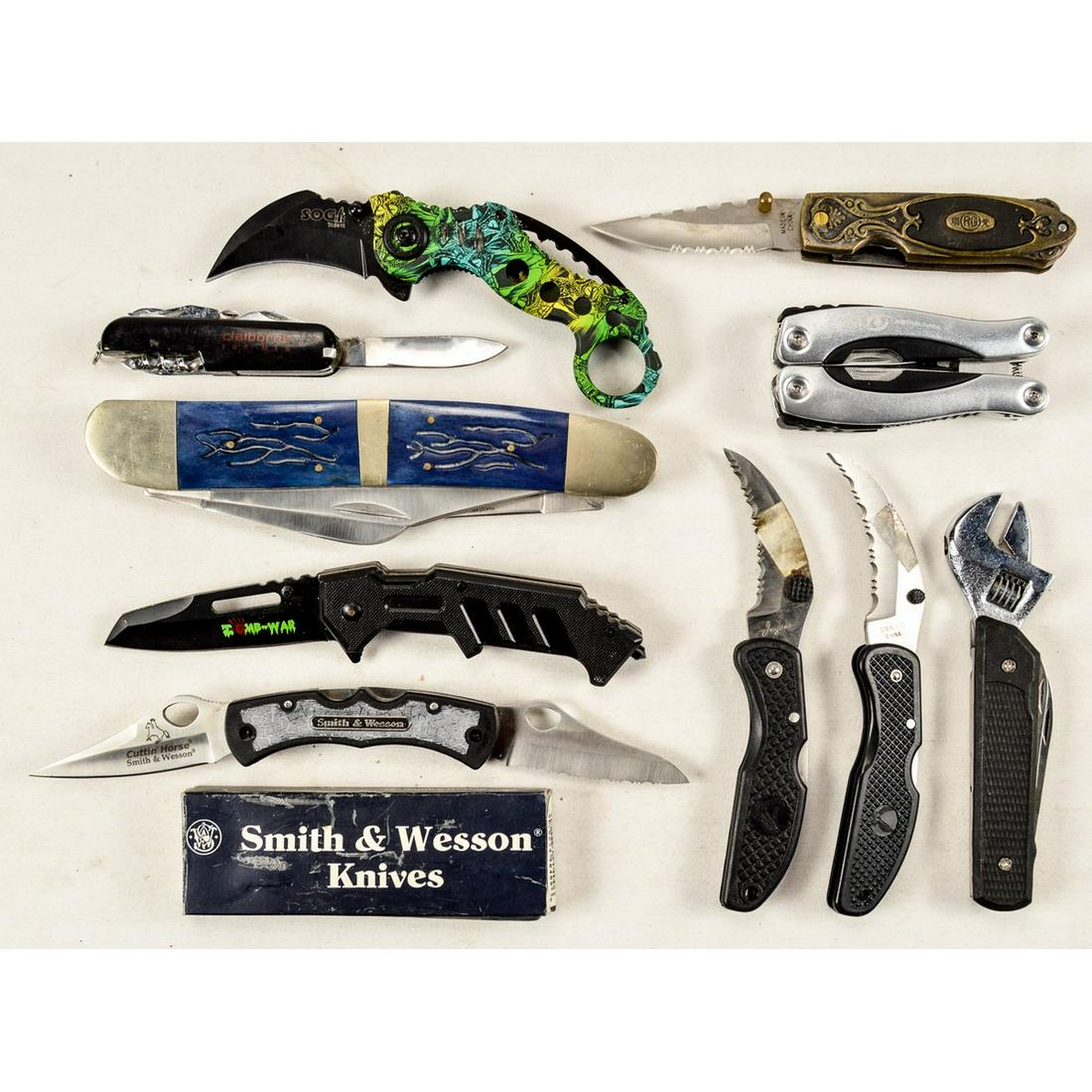 Lot of 10 Knives & Multi-Tools: Lot contains 10 knives and multi-tools with one of the knives being a Smith & Wesson knife in box. Various lengths, makes, and types.